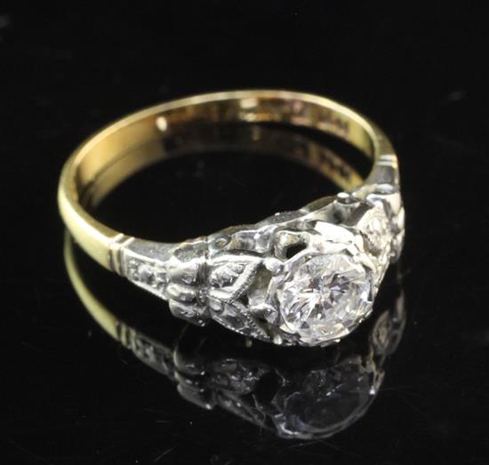 A 1940s/1950/s 18ct gold and platinum solitaire diamond ring, size L.